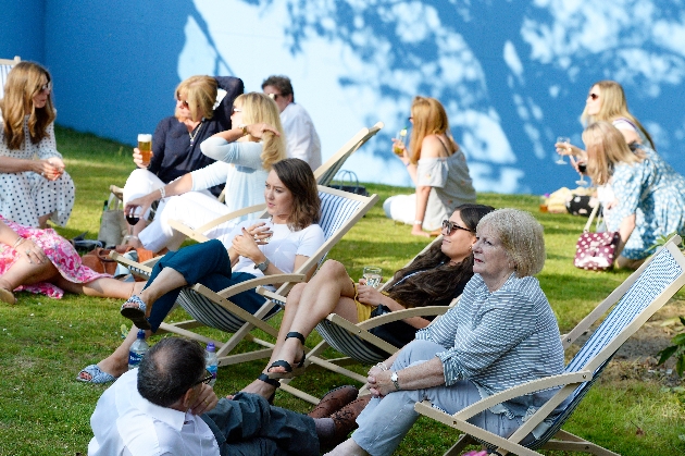 people on deck chairs