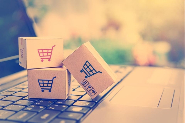 Boxes with shopping trolleys on, placed on a keyboard