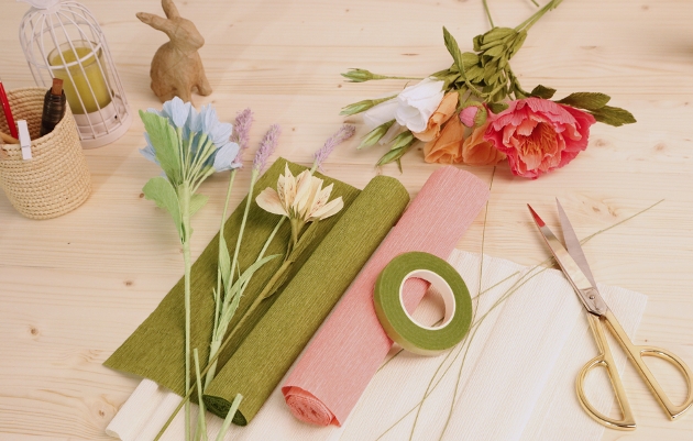 crepe coloured papers rolled out with scissors and crafting tools