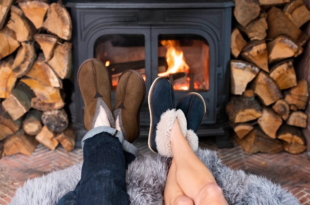 male and female legs with slippers on 