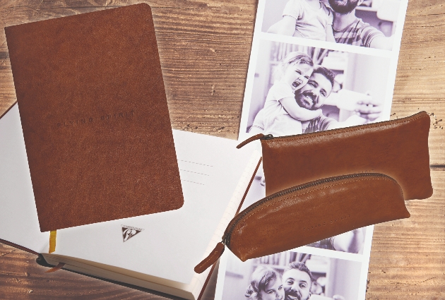 brown leather pad and pencil cases