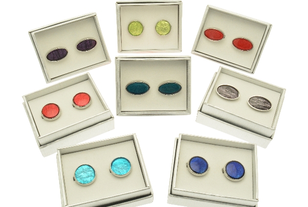 cufflinks in different colours in different boxes
