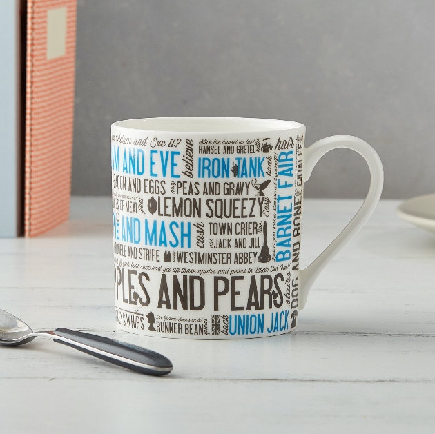 mug with blue and black lettering on 