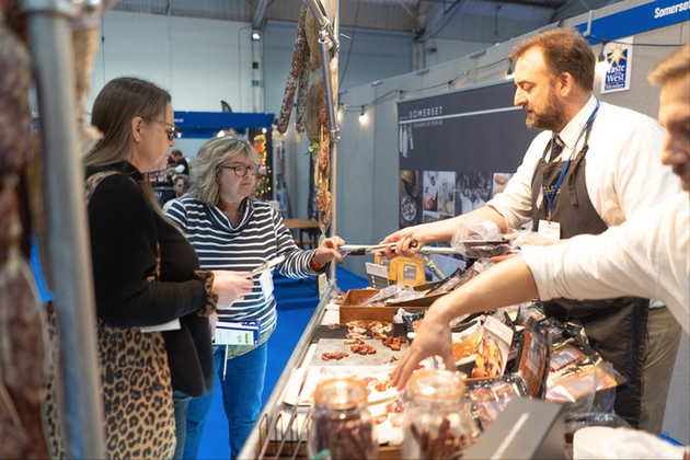 Visitors try food at the Source Roadshow 