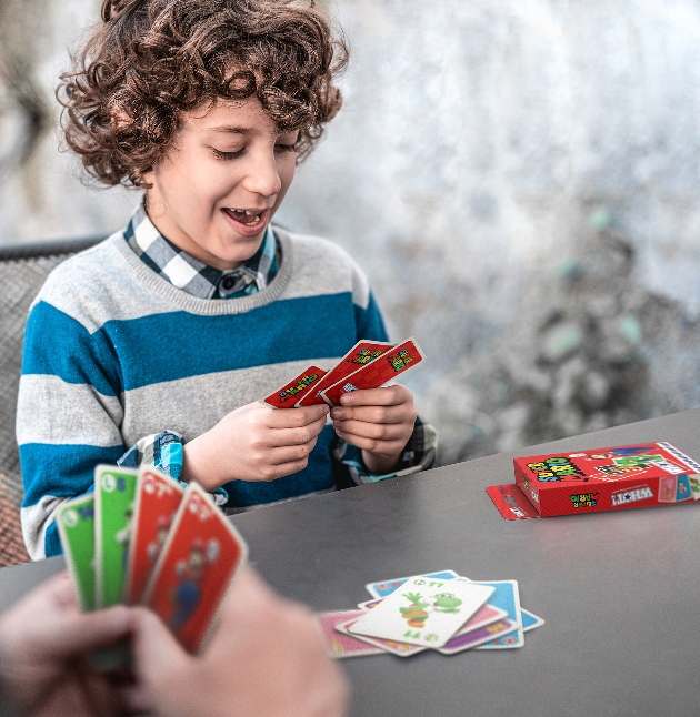 Super Mario card game boy playing with man