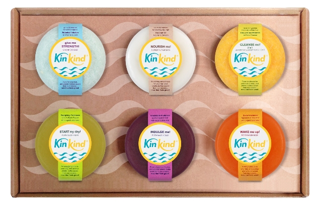 six coloured round shampoo bars in a box