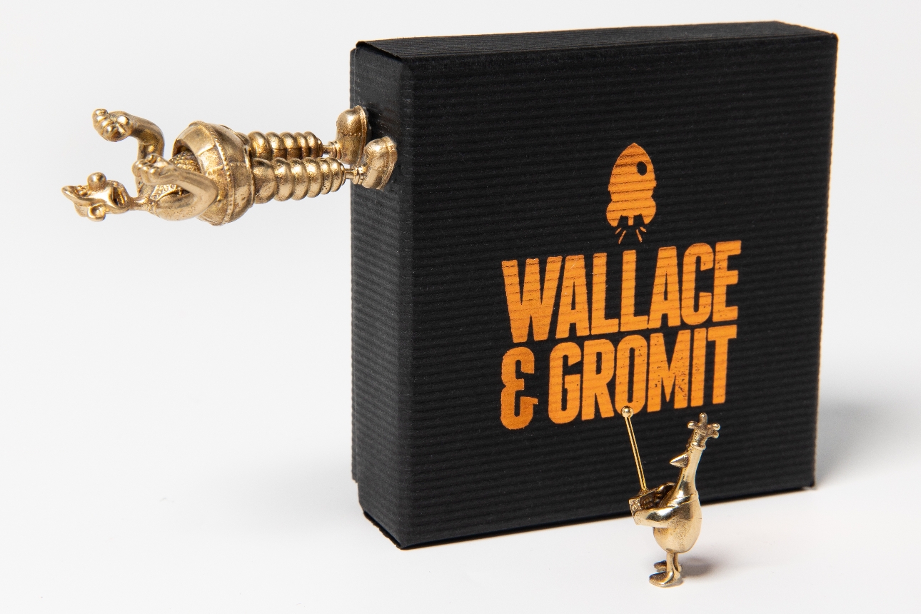 The Wallace and Gromit Collection gold figures of wallace and penguin with black box for packaging