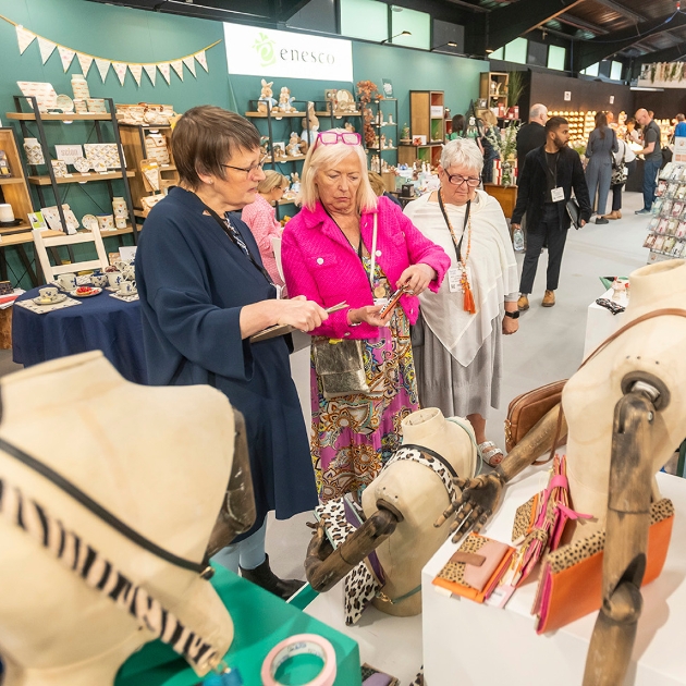 people looking at products at show