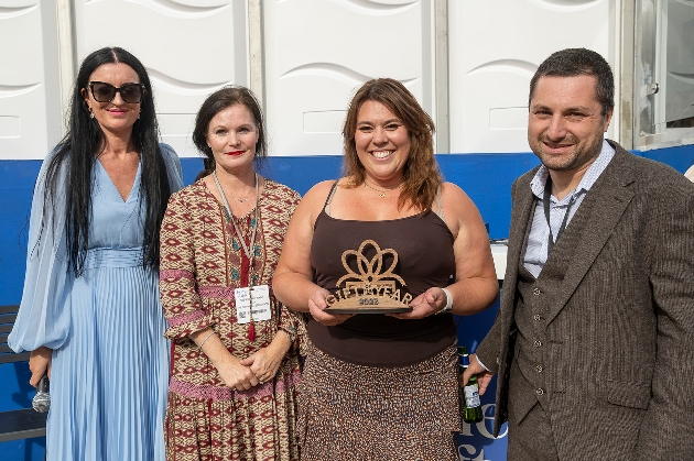 people holding award in group 