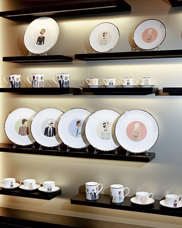 mugs and plates in pile with different icons on