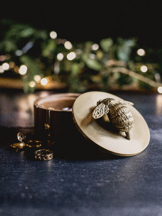 trinket box with a gold bee on top