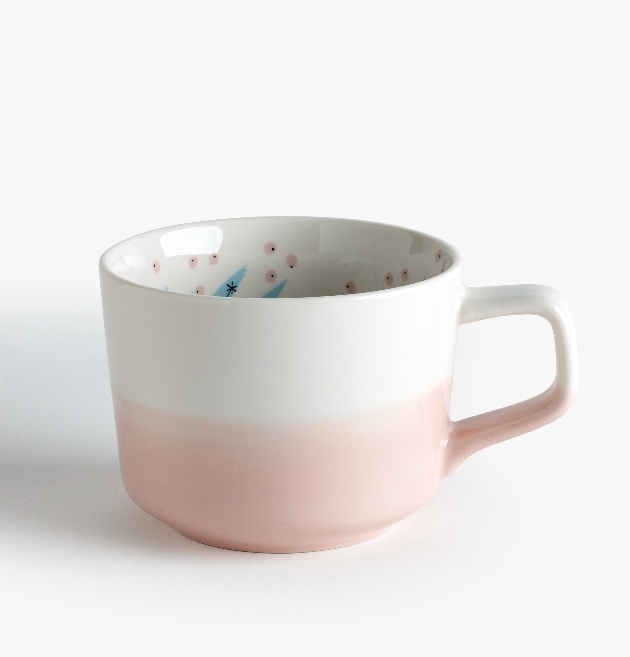white and pink mug