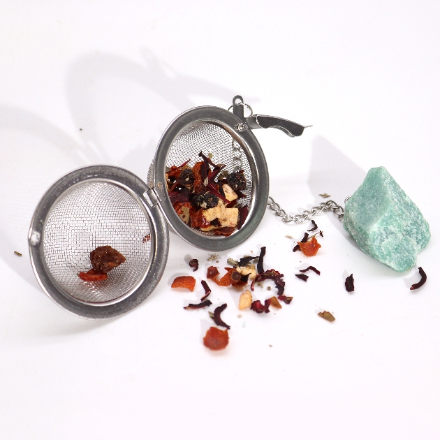 blue gemstone on tea strainer