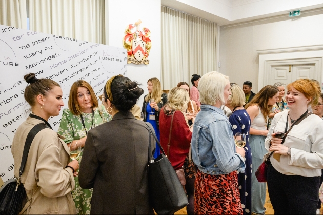 women at event mingling and talking