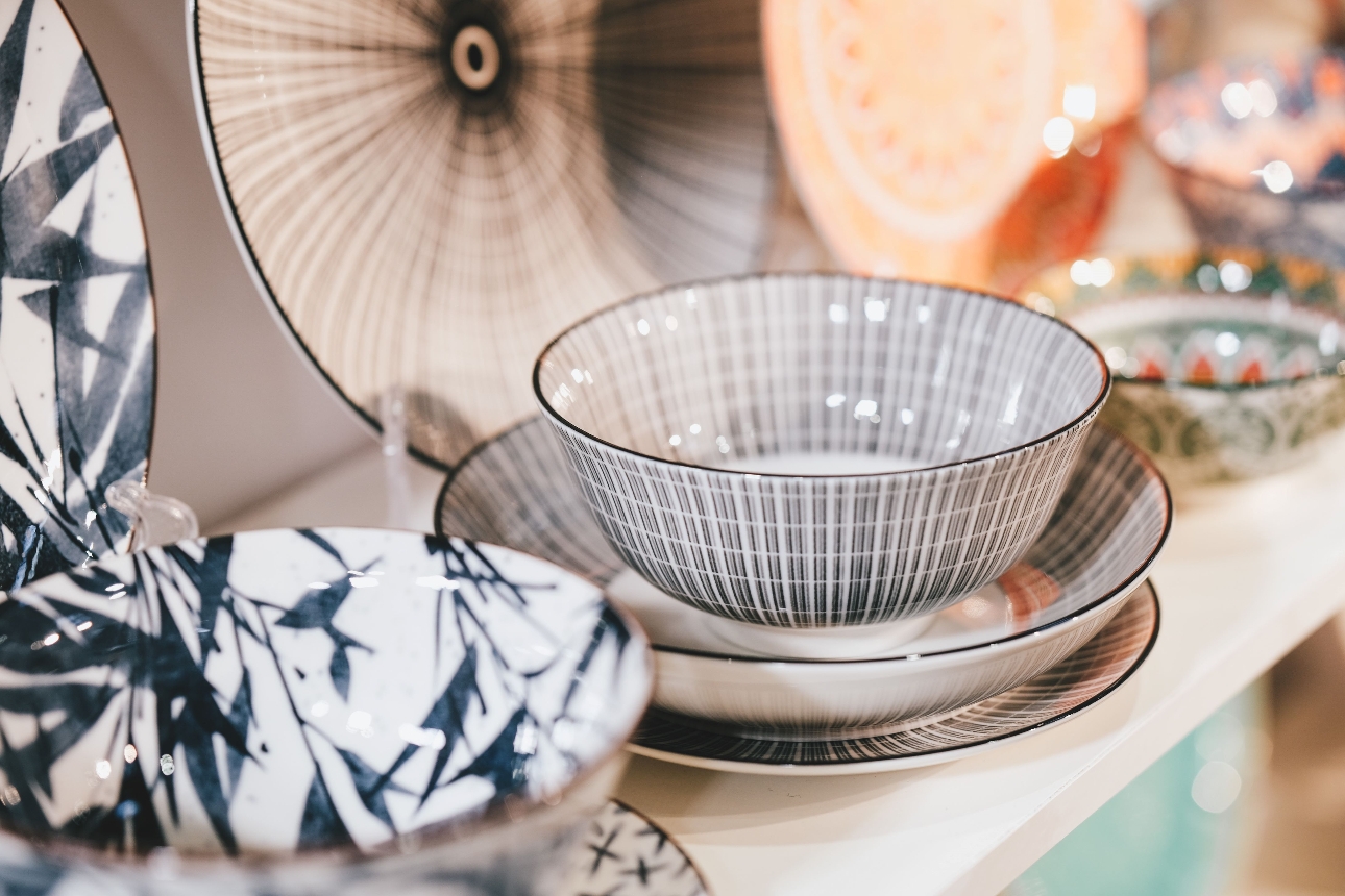 patterned crockery on a shelf plates and bowls