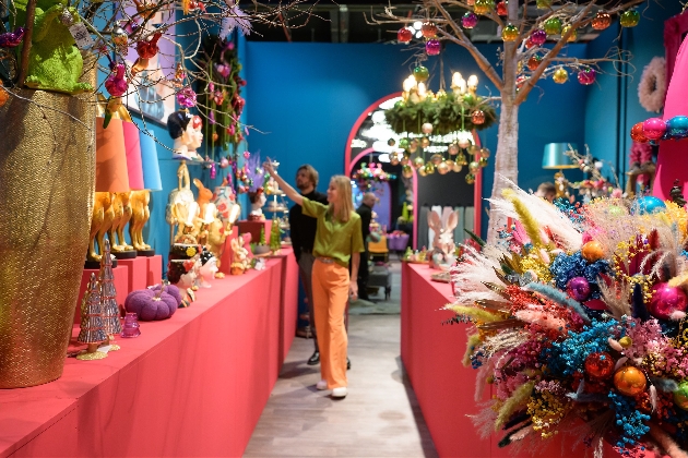 pink tables adorned with bright christmas decorations and faux flowers
