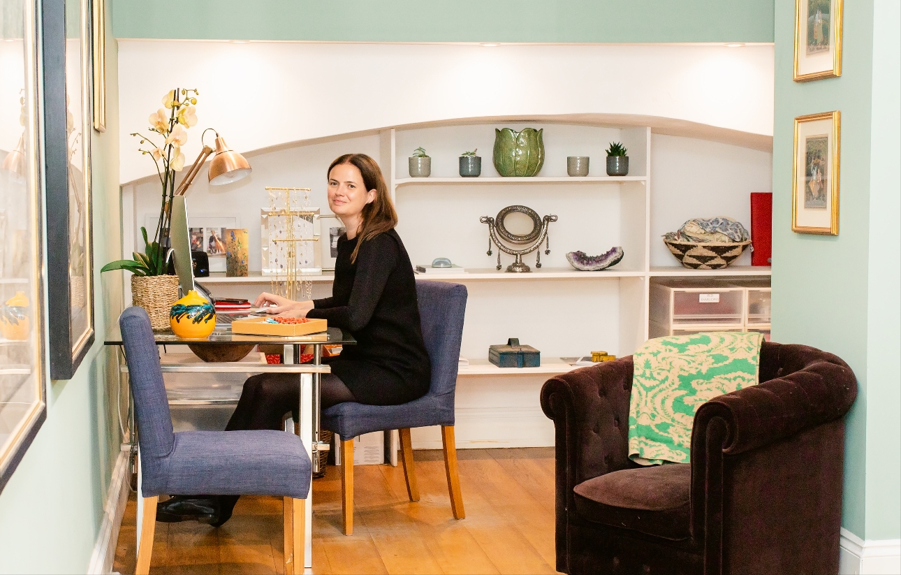 owner of store sat at table in shop