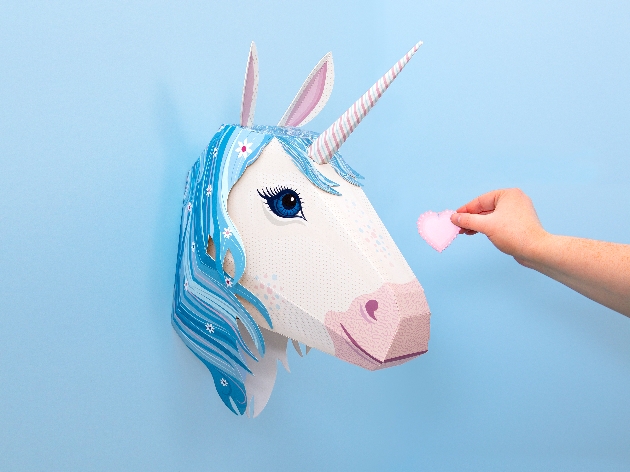 cardboard unicorn head on wall