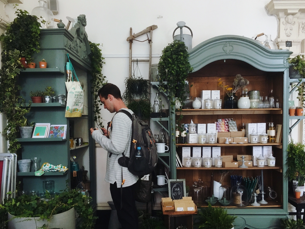 man in a shop buying products