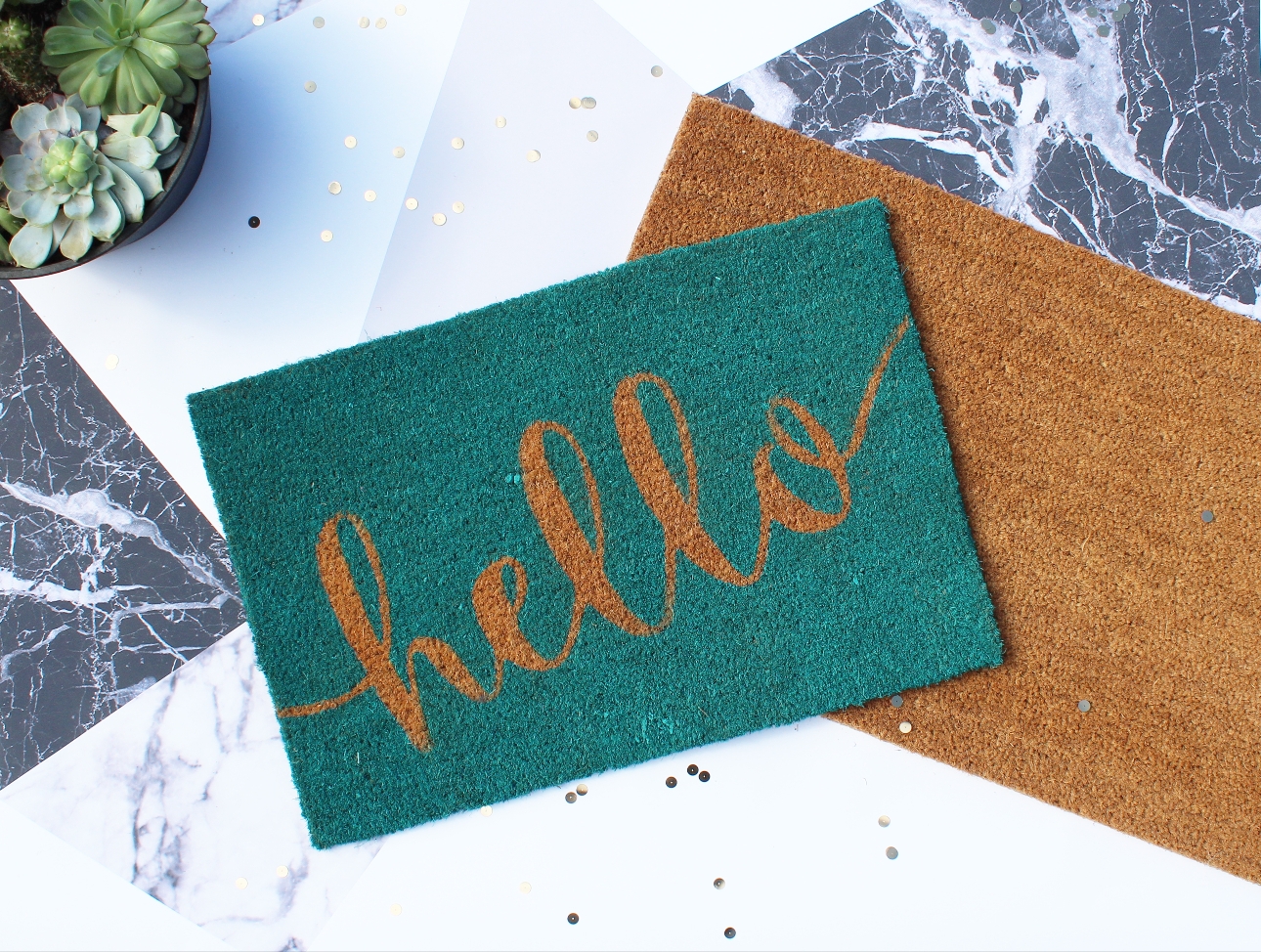 green door mat with the word hello on it 