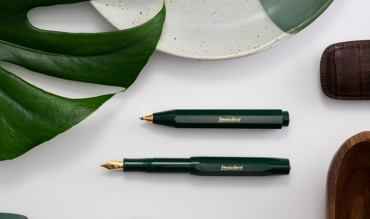 two green pens with gold nibs