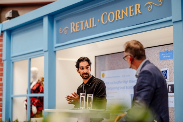 two men in discussion at a trade show
