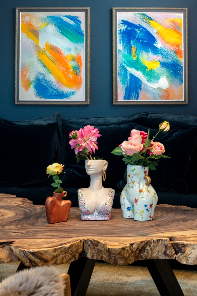 painter vases with art in the background
