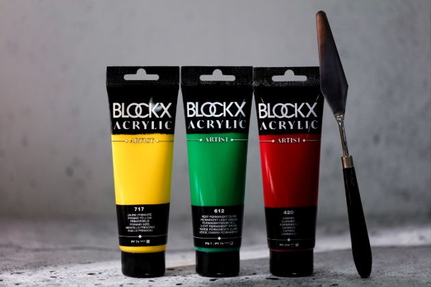 PALETTE KNIFE AND THREE TUBES OF PAINT